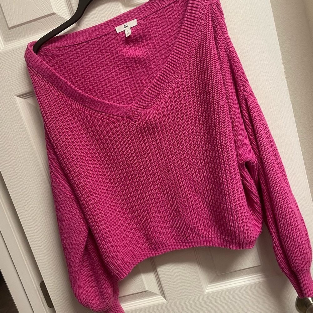 Vibrant Pink V-Neck Sweater with Long Sleeves and Ribbed Texture